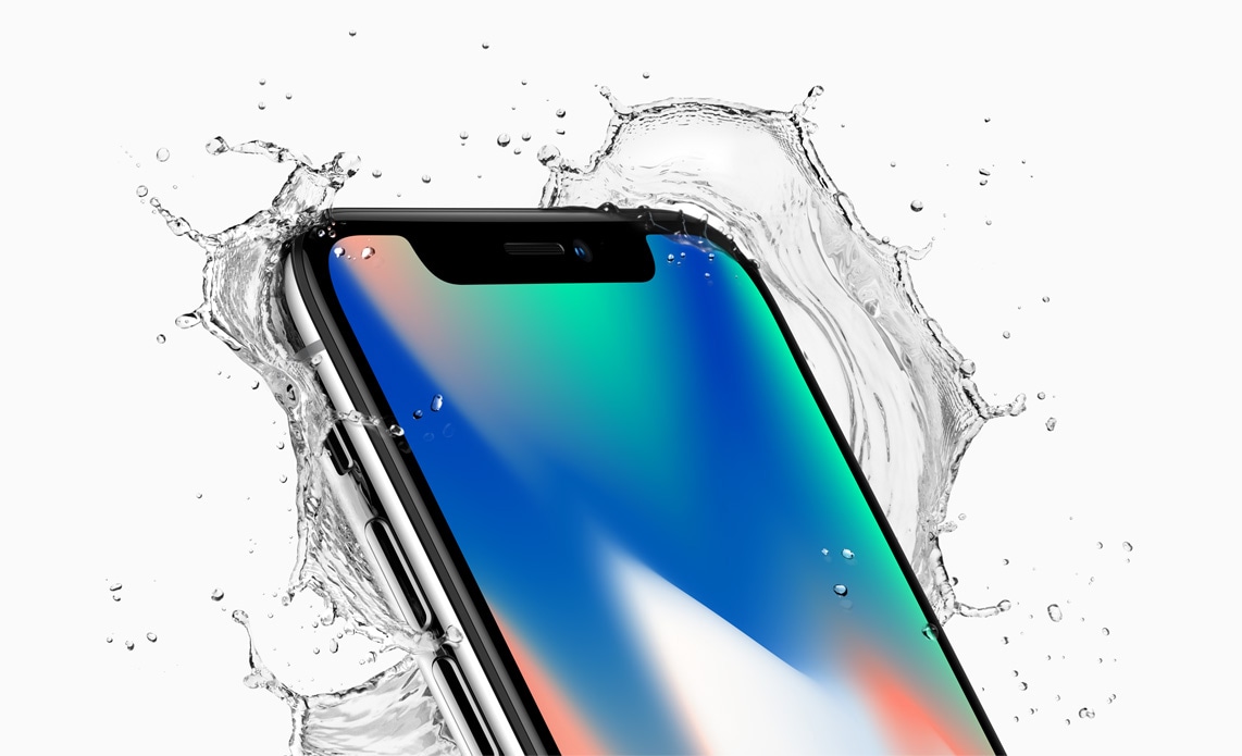 iPhone X with splashing water