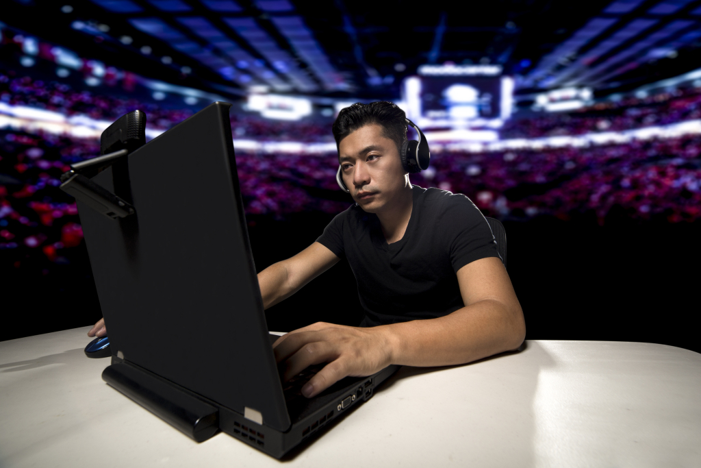Commentator watching e-Sports on computer