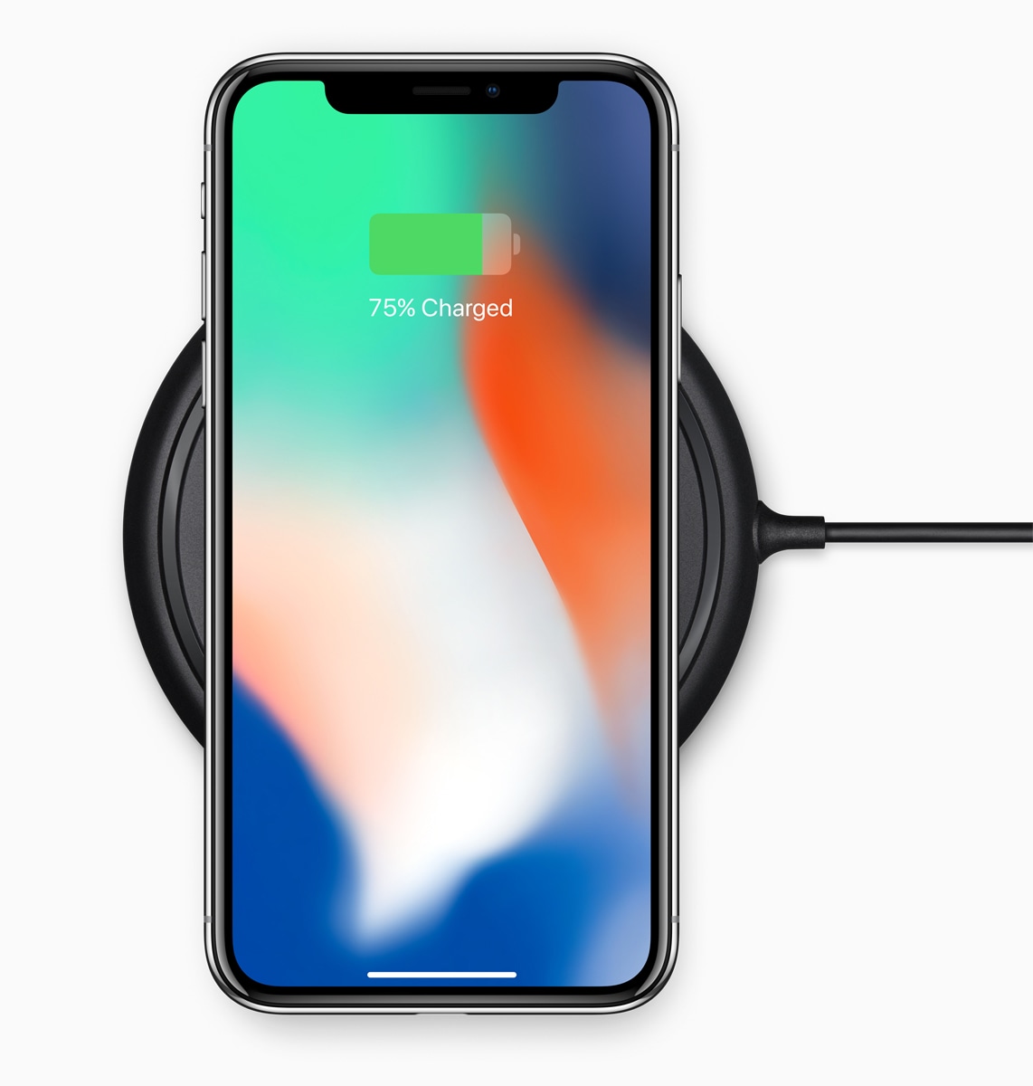 iPhone X on a wireless charging base