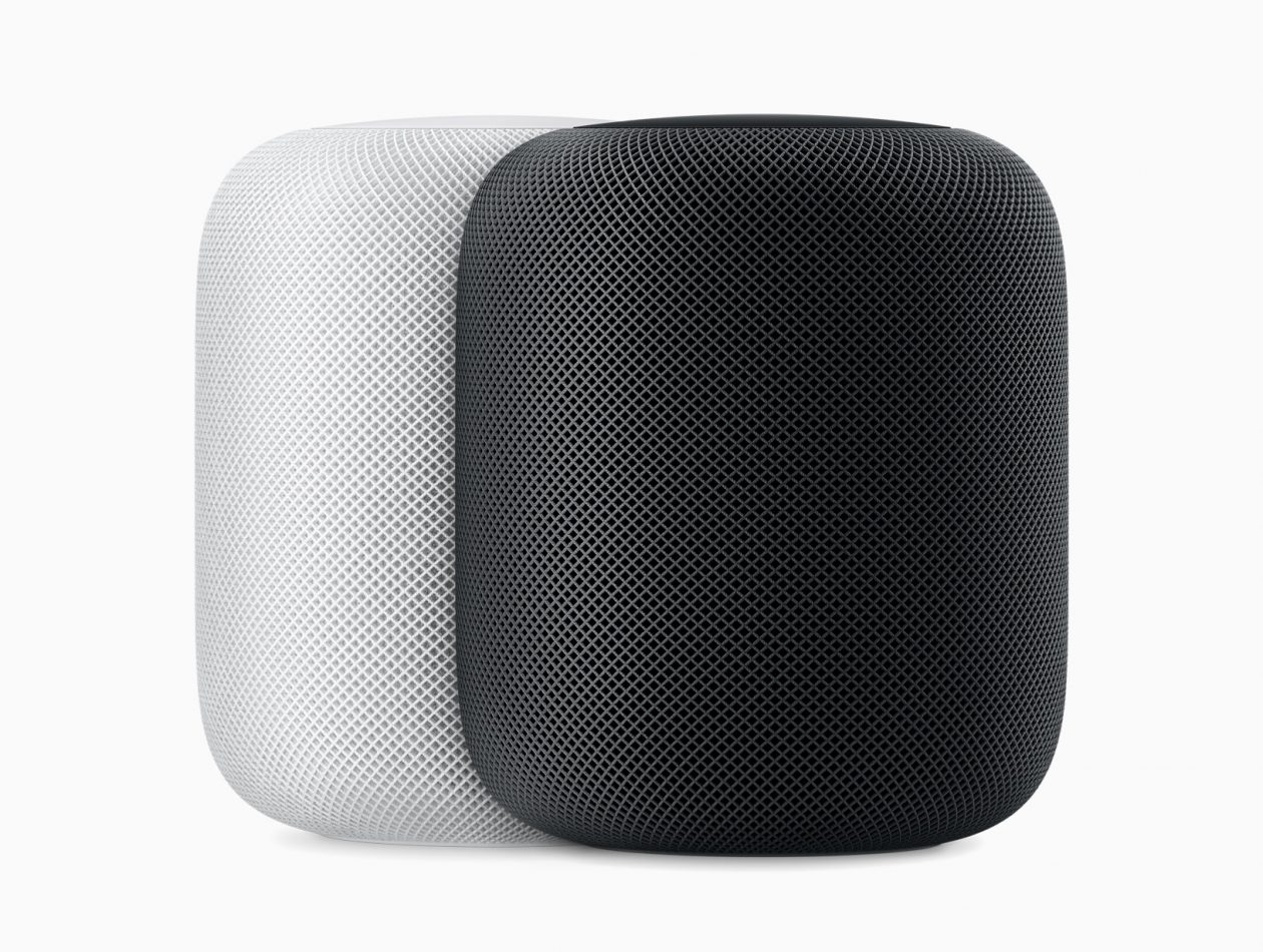 White and black HomePod side by side