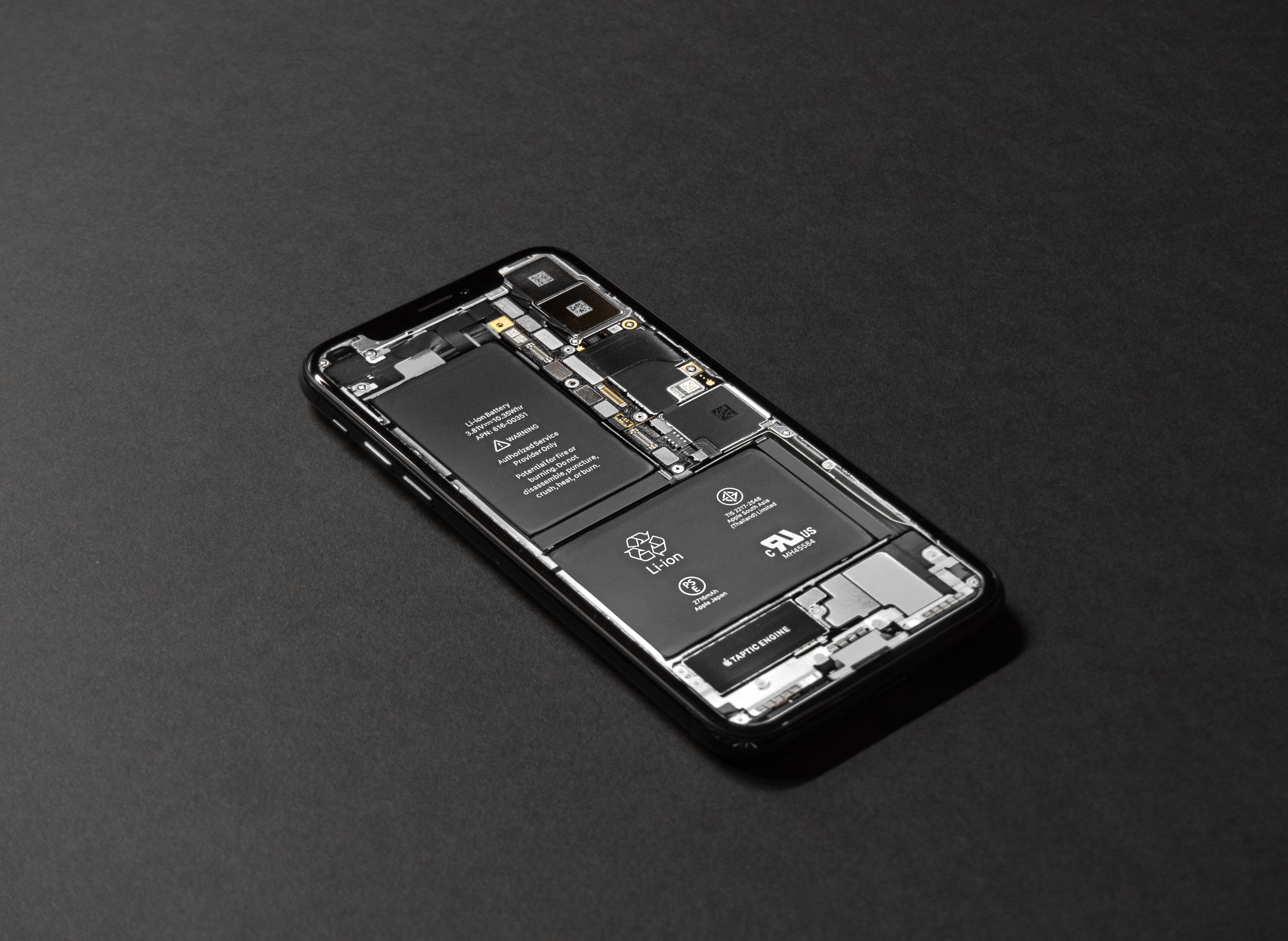 iPhone with exposed components (battery)